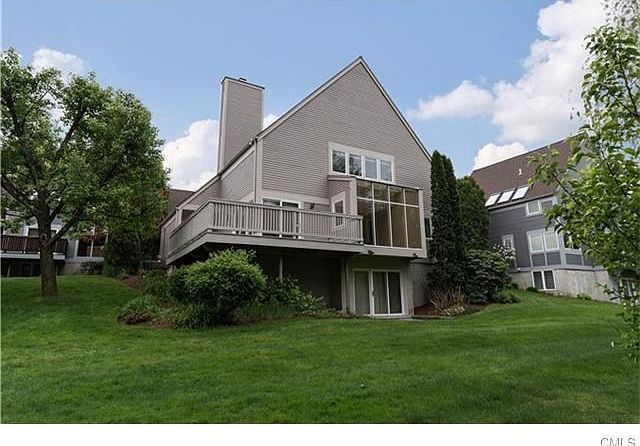 Back of house that overlooks the river and pond