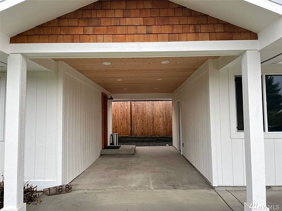 Awesome breezeway boasts of tongue and groove ceiling with recessed lighting. 