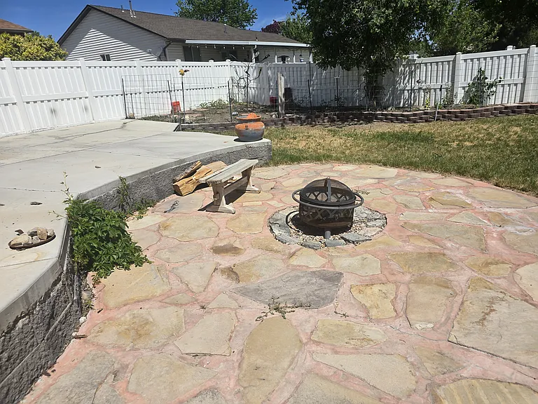 Outdoor fire pit, for those hotdog moments. RV parking off to left.
