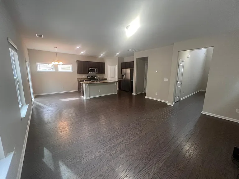 Open floor plan for kitchen and living room with island. You can make dinner while watching your children play.