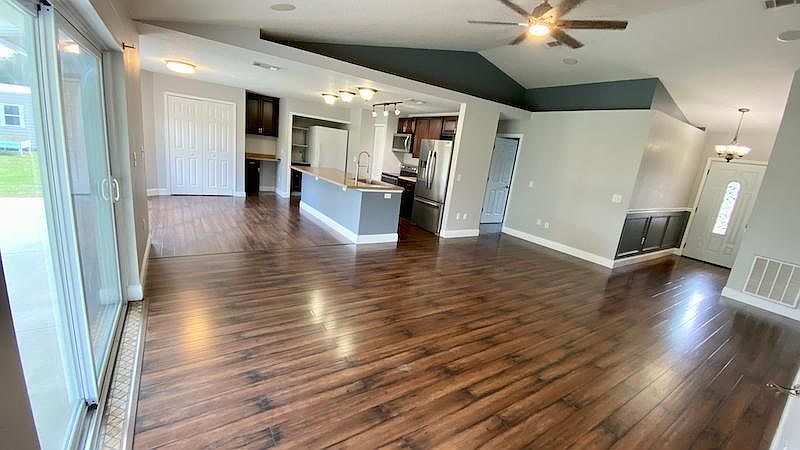 Large family/kitchen/dining combo view #1