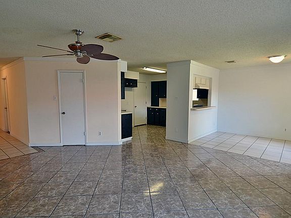 The family room is very spacious with Spanish tile and open to the dining area and kitchen.