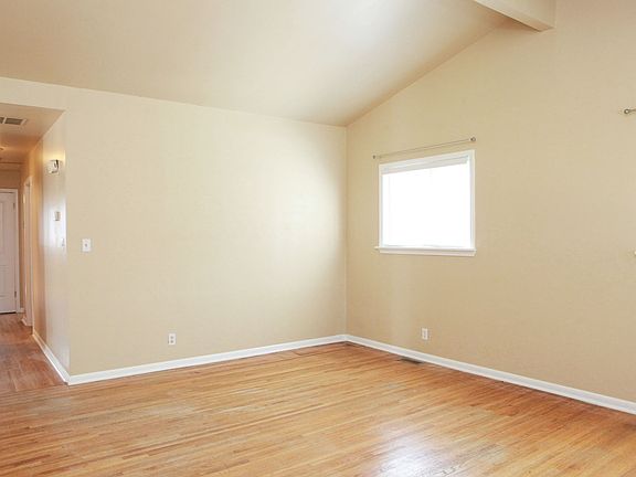 Another view of the spacious living area w/fresh interior paint