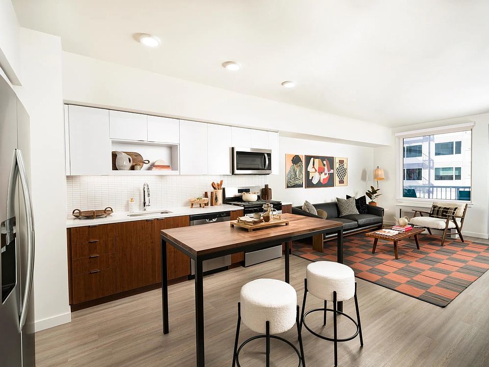 Chef-inspired kitchens featuring quartz countertops, designer cabinetry, and sleek under-cabinet lighting.