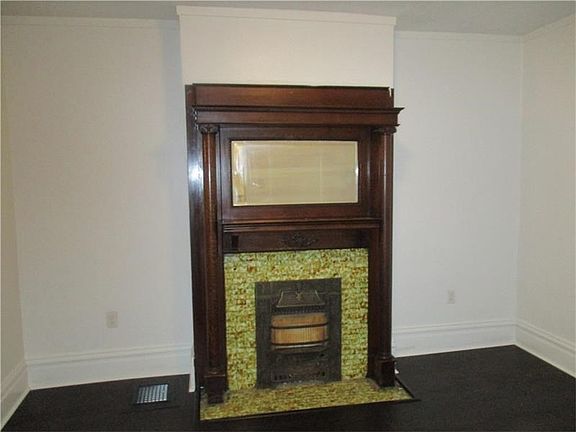 Gorgeous mantel with mirror is a great center piece for the Living Room.