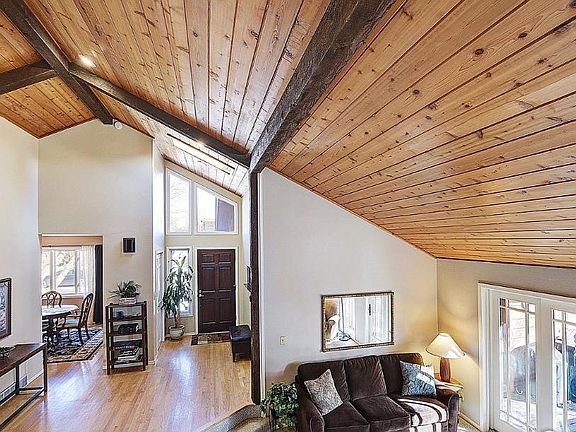 View into living room/entry way from staircase.