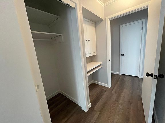 Hallway with built in desk and closer