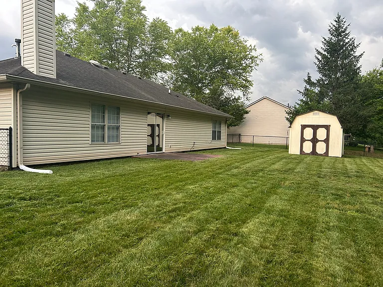 fenced in backyard and shed