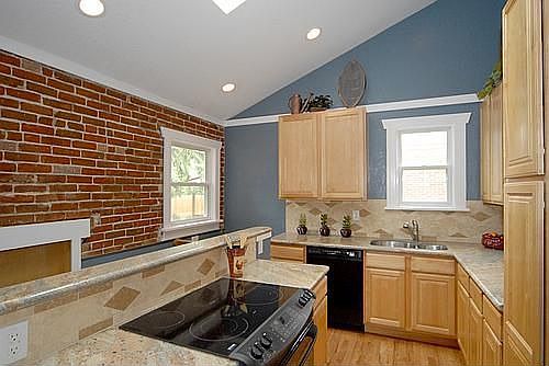 Updated kitchen with exposed brick