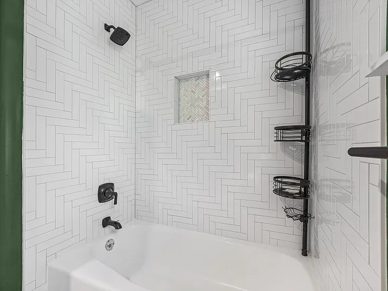 Downstairs bathroom with a recently renovated shower.