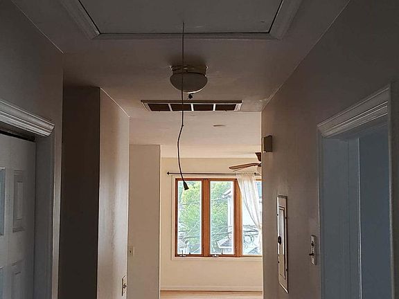 pull down in the hallway to the attic with some storage / washer dryer hook up in hallway