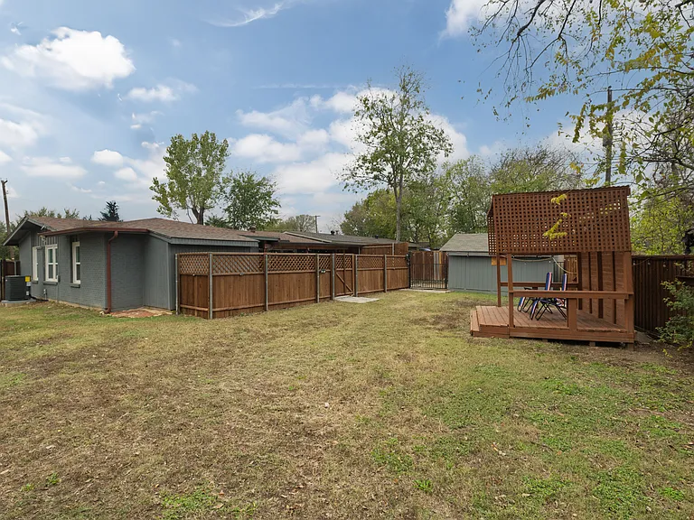 Spacious fenced backyard with plenty of room to relax, play, or for your furry friends to run around. Features a cozy pergola with seating for 2_perfect for morning coffee, outdoor meals, or unwinding in a quiet, private setting.