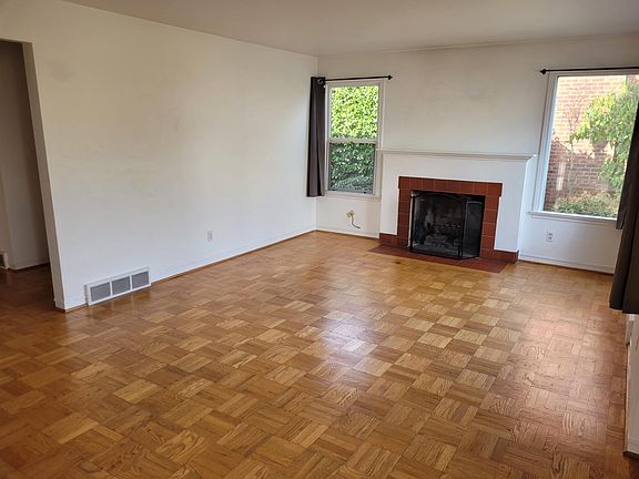 Living room w/ fireplace.