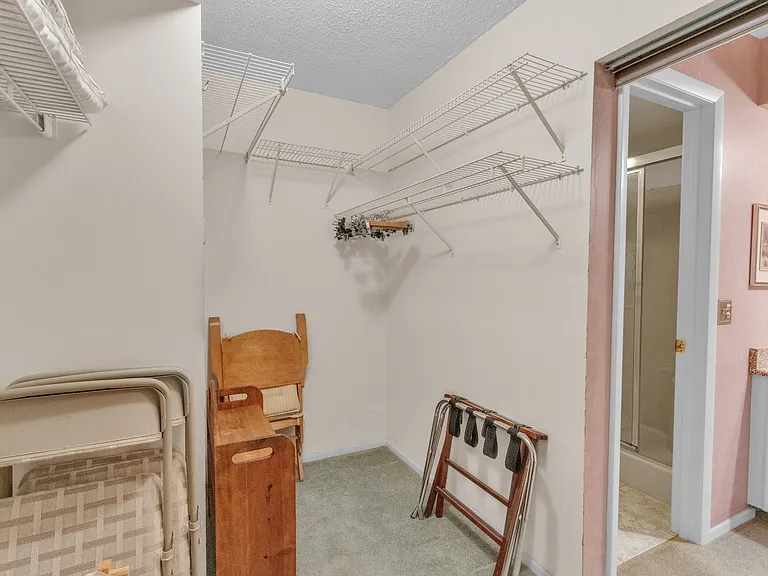 Other side of HUGE primary walk-in closet