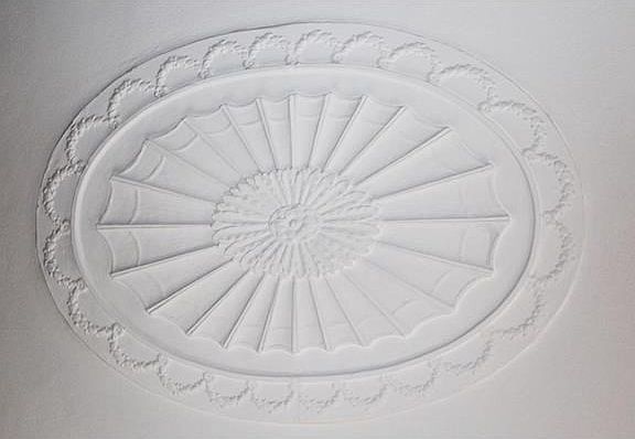 Handmade medallion on living room ceiling