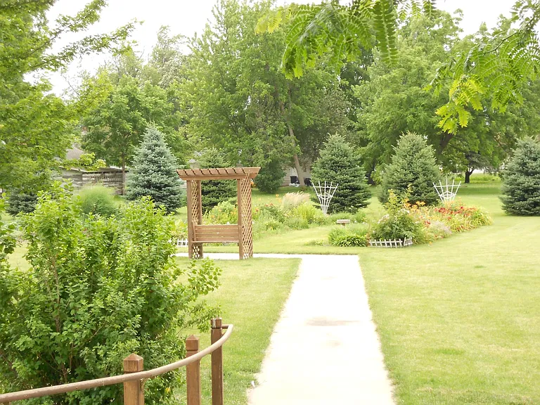 courtyard and sidewalk to raised vegetable gardens