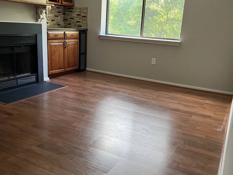 Dining room space with centerpiece fireplace, cabinet space, and wine fridge
