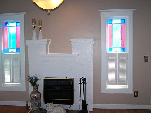 Fireplace with gas logs,  Original Stained glass windows