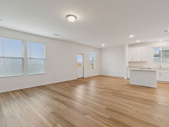 Bright gathering room with large windows real home pictured