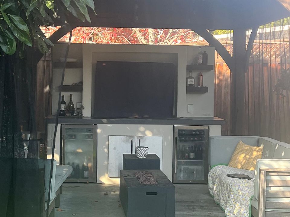 outdoor living space (shared) TV, couches, two mini fridges. Most days and nights, we do not use this.