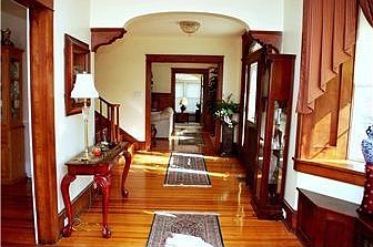 Gracious entry foyer with rich wood trim