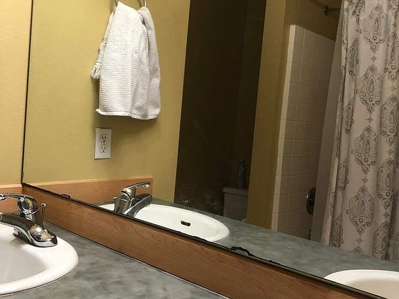 Master bath with dual sinks and bathtub.