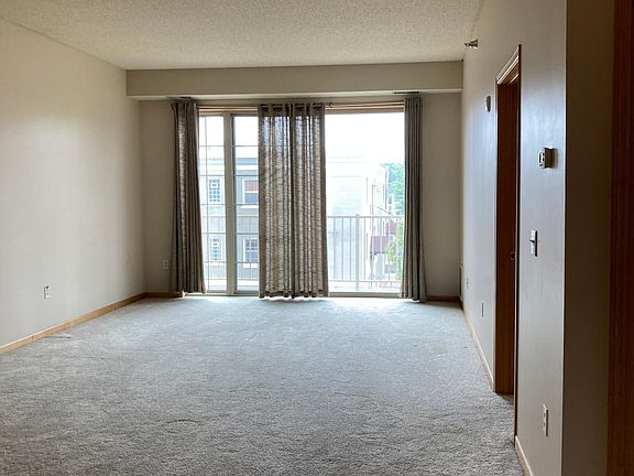 Living/dining area with sliding door to balcony