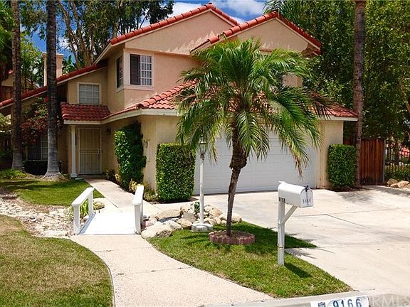 Upon arriving you are greeted by these beautiful trees and adorable bridge leading into the home of 