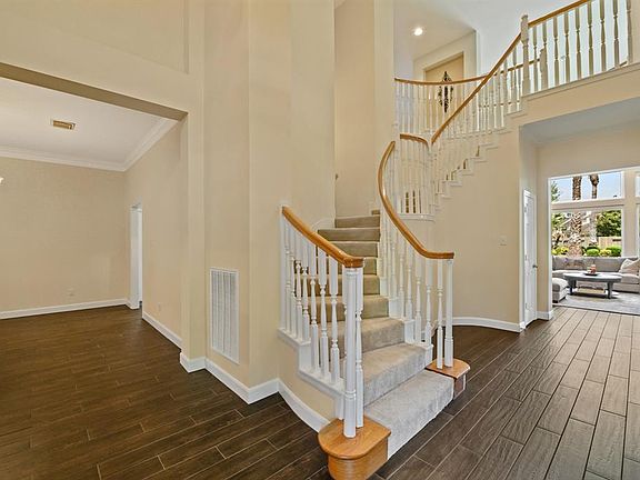 View from the front door showcases the formal dining room as well as the entrance into the living area.