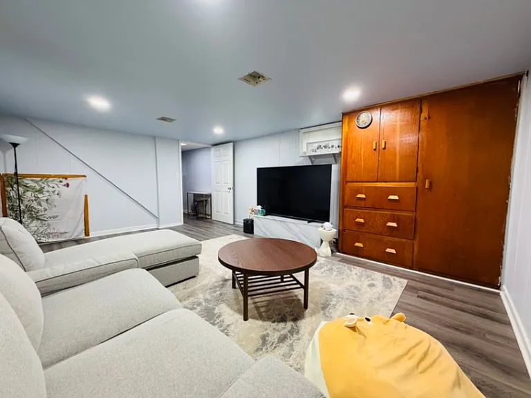 Large finished basement with rec/media room and built-in cabinets