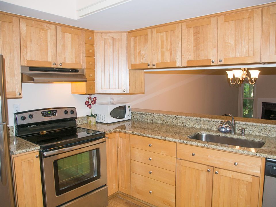 Newer kitchen with granite and stainless steel.