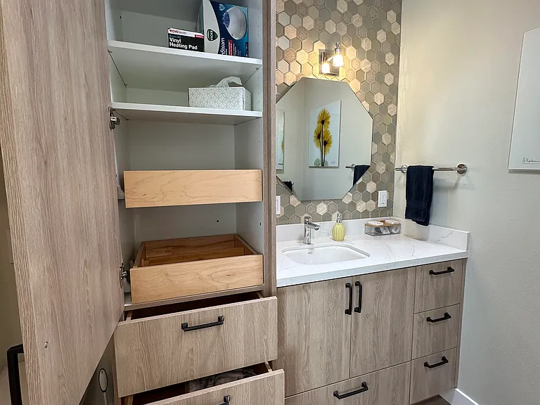 Bathroom #2 - sink and storage, toilet is to the left of the storage cabinet