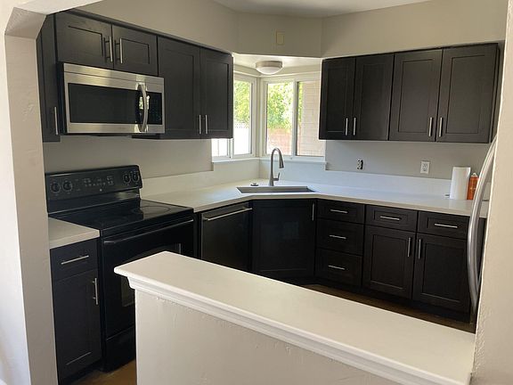 Brand new kitchen with new cabinets, quartz countertops, sink and faucet