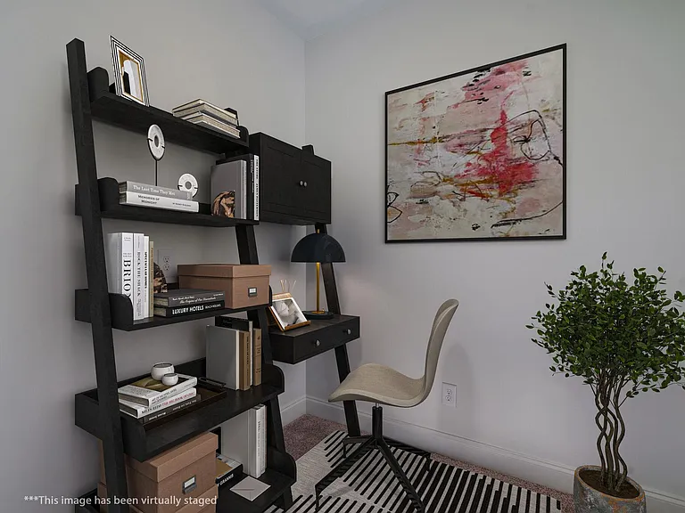 Home office in addition to the two other bedrooms. It has lots of natural light. Staged photo