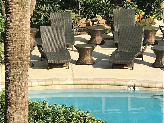 Lushly Landscaped Crytal Blue Pool