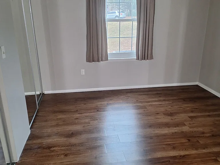Master bedroom is 12x16 with mirrored closet doors.
