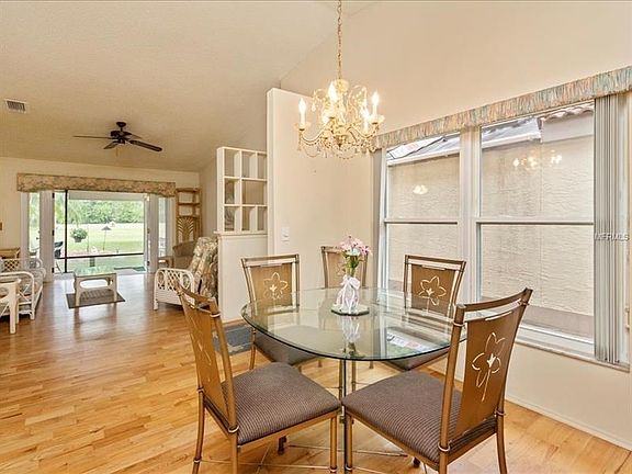 Dinette overlooking living room, with golf course view.