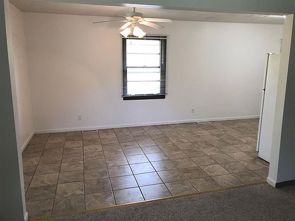 Spacious country kitchen has room for a table with seating for 8.