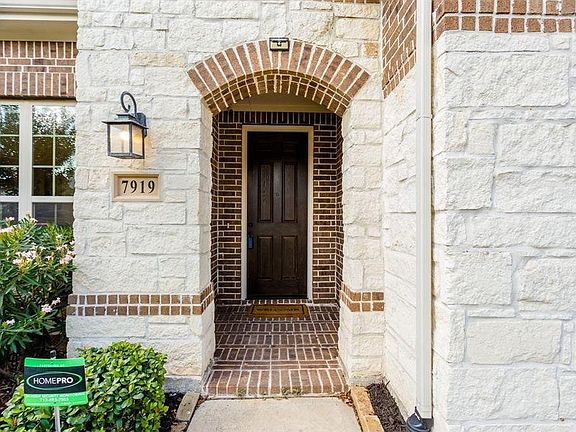 A large covered brick front porch welcomes you and your guests, plus the pre-wired security cameras outside will add piece of mind.
