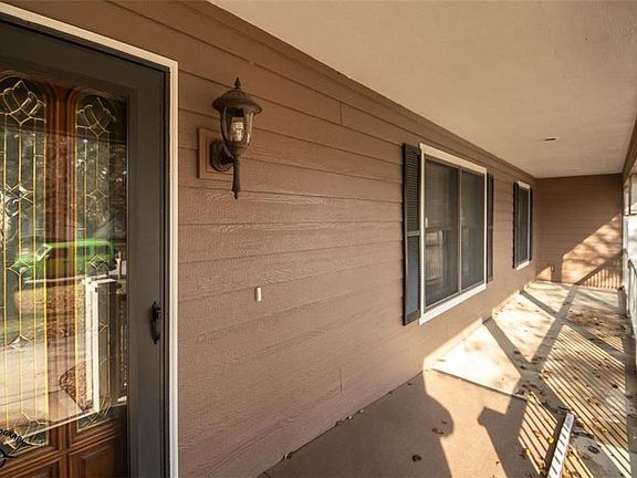 Nice nice front porch with a ramp that may be left or removed.  Excuse the leaves, but the weather would not cooperate long enough to wash it down!