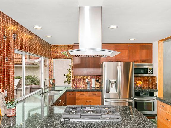 Updated kitchen with gas range, electric oven, ocean views