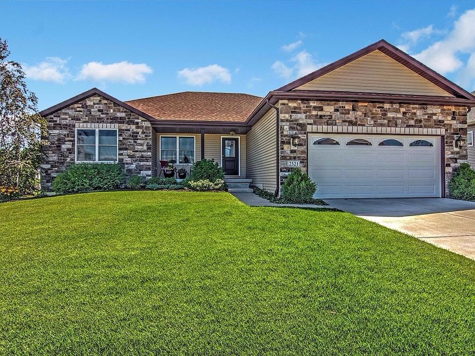 STONE & VINYL SIDED 3 BED 2 BATH 1885 SQUARE FOOT SPLIT FLOOR PLAN RANCH OFFERING A FULL BASEMENT AN