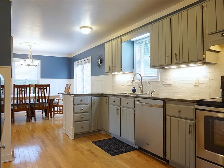 Kitchen with Hardwood Floors and open to Dining Room