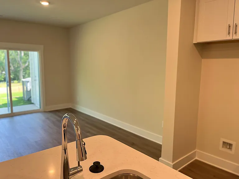 view from kitchen. fridge has been installed since photos were taken