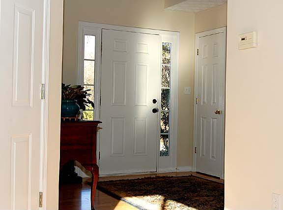 Foyer w/ Cathedral Ceilings & Hardwood Floor