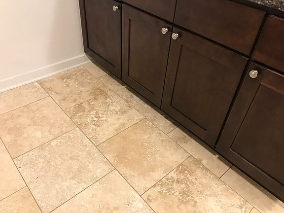 Kitchen - new beautiful travertine tile floor