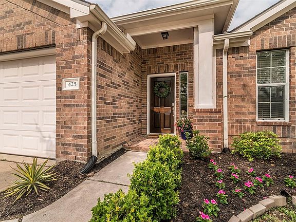 Walkway Curves Around A Beautifully Landscaped Yard To The Front Door Entry