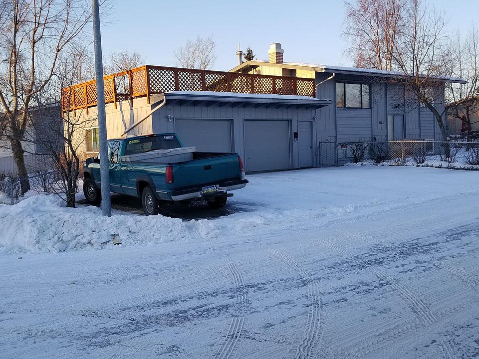 NW corner lot (Norene and Alexander) with beautiful mountain views on three sides. Tenant Garage door on right and private entry shown outside of gate. Deck can be used for planting flowers or vegetables, barbequing, entertaining, resting and viewing.