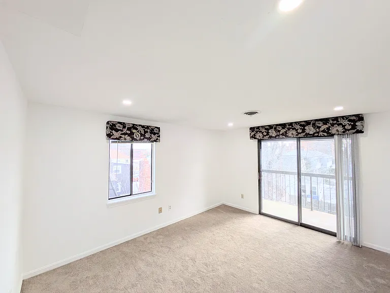 Bedroom with a slider to the balcony