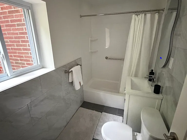 Brand new tile, toilet & vanity.